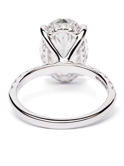 Trotters Platinum 5ct Lab Grown Oval Diamond Ring With Diamond Set Shoulders & Hidden Diamond Halo
