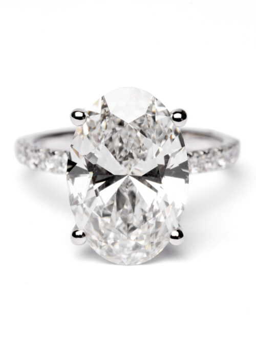 Trotters Platinum 5ct Lab Grown Oval Diamond Ring With Diamond Set Shoulders & Hidden Diamond Halo