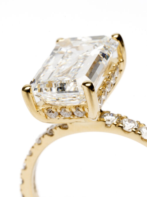 Trotters 18ct Yellow Gold 3.05ct Lab Grown Emerald Cut Diamond Ring With Diamond Set Shoulders