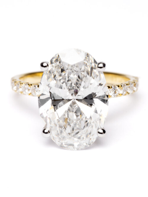 Trotters 18ct Yellow Gold & Platinum 5ct Lab Grown Oval Diamond Ring With Diamond Set Shoulders & Hidden Diamond Halo