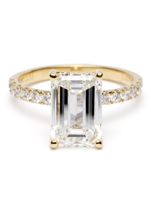Trotters 18ct Yellow Gold 3.05ct Lab Grown Emerald Cut Diamond Ring With Diamond Set Shoulders