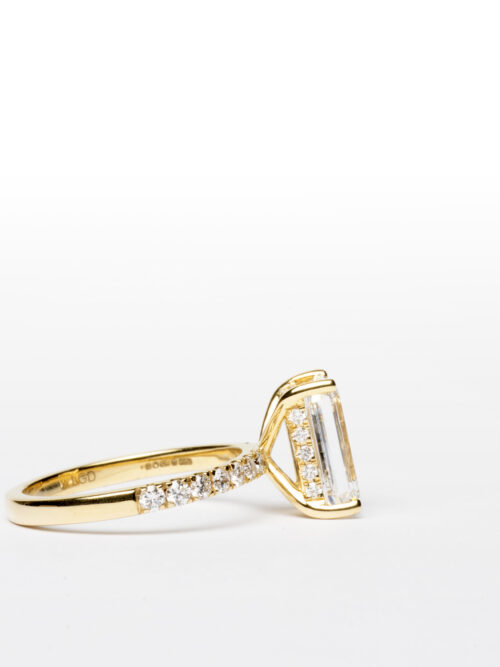 Trotters 18ct Yellow Gold 3.05ct Lab Grown Emerald Cut Diamond Ring With Diamond Set Shoulders