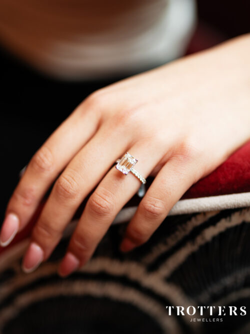 Trotters Platinum 3ct Lab Grown Emerald Cut Diamond Ring With Diamond Set Shoulders & Hidden Halo