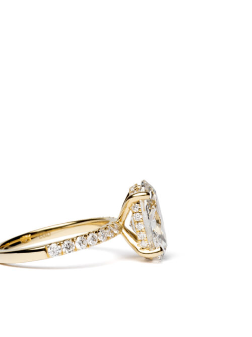 Trotters 18ct Yellow Gold 3ct Lab Grown Oval Diamond Ring With Diamond Set Shoulders And Hidden Diamond Halo