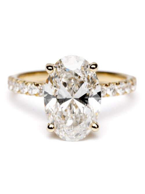 Trotters 18ct Yellow Gold 3ct Lab Grown Oval Diamond Ring With Diamond Set Shoulders And Hidden Diamond Halo