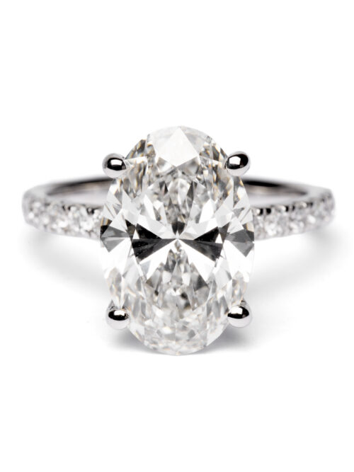 Trotters Platinum 4ct Lab Grown Oval Diamond Ring With Diamond Set Shoulders And Hidden Halo