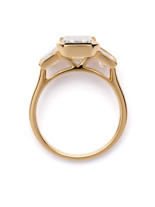 Trotters 18ct Yellow Gold 3ct Emerald Cut Lab Grown Diamond Ring With Baguette Shoulders Bezel / Rubover Set