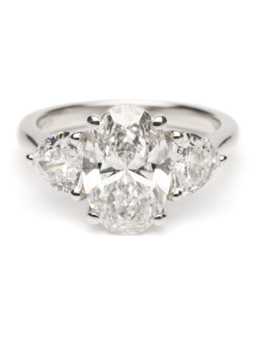 Trotters Platinum Three Stone Lab Grown Diamond Ring With Oval Centre 2.50ct And Heart Shoulders