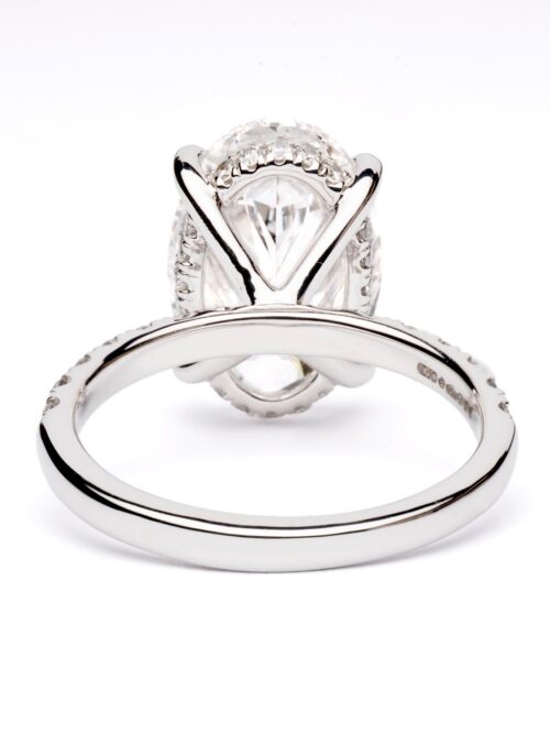 Trotters Platinum 5ct Oval Cut Lab Grown Diamond Ring With Diamond Set Shoulders And Hidden Diamond Halo