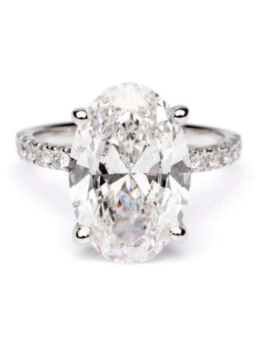 Trotters Platinum 5ct Oval Cut Lab Grown Diamond Ring With Diamond Set Shoulders And Hidden Diamond Halo