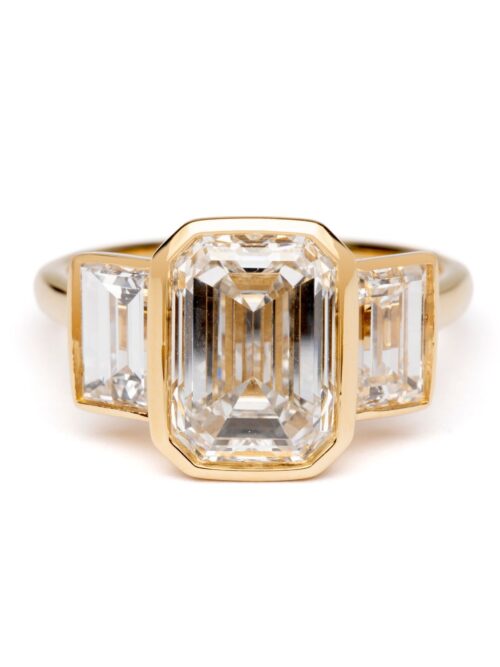 Trotters 18ct Yellow Gold 3ct Emerald Cut Lab Grown Diamond Ring With Baguette Shoulders Bezel / Rubover Set