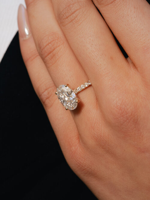 Trotters 18ct Yellow Gold 3ct Lab Grown Oval Diamond Ring With Diamond Set Shoulders And Hidden Diamond Halo