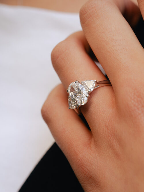 Trotters Platinum Three Stone Lab Grown Diamond Ring With Oval Centre 2.50ct And Heart Shoulders