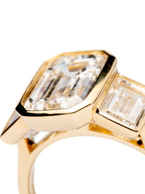 Trotters 18ct Yellow Gold 3ct Emerald Cut Lab Grown Diamond Ring With Baguette Shoulders Bezel / Rubover Set