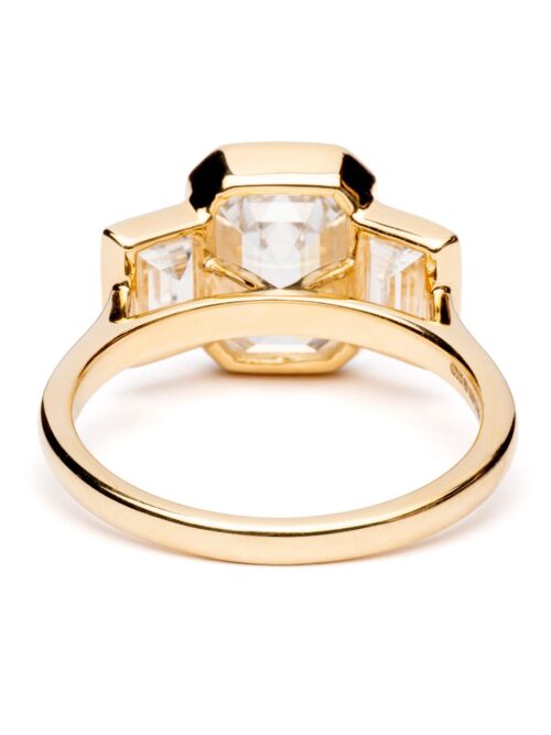 Trotters 18ct Yellow Gold 3ct Emerald Cut Lab Grown Diamond Ring With Baguette Shoulders Bezel / Rubover Set