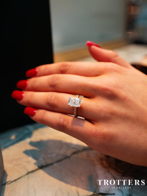 Trotters 18ct Yellow Gold 3ct Cushion Cut Lab Grown Diamond Ring With Diamond Set Shoulders And Hidden Diamond Halo