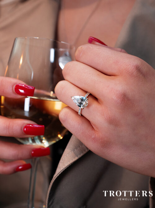 Trotters 18ct Yellow Gold 3ct Pear Cut Lab Grown Diamond Ring With Diamond Set Shoulders And Diamond Set Claws