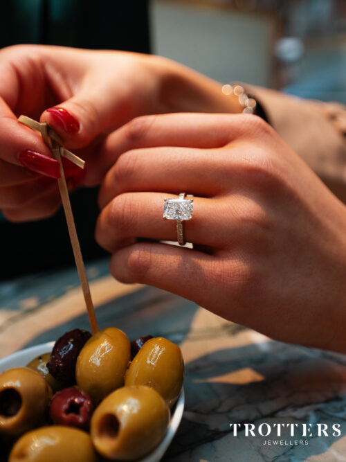 Trotters 18ct Yellow Gold 3ct Cushion Cut Lab Grown Diamond Ring With Diamond Set Shoulders And Hidden Diamond Halo