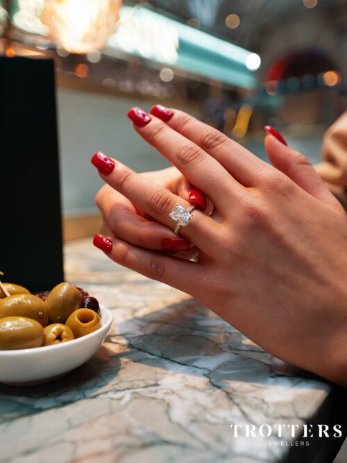 Trotters 18ct Yellow Gold 3ct Cushion Cut Lab Grown Diamond Ring With Diamond Set Shoulders And Hidden Diamond Halo