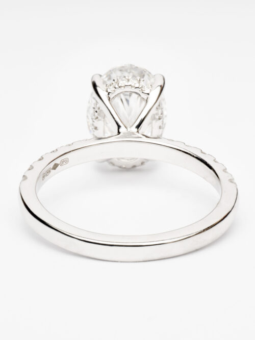 Trotters Platinum 2.50ct Oval Cut Lab Grown Diamond Ring With Diamond Set Shoulders And Hidden Diamond Halo