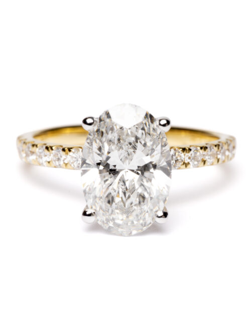 Trotters 18ct Yellow Gold & Platinum 2.6ct Lab Grown Oval Diamond Ring With Diamond Set Shoulders & Hidden Diamond Halo