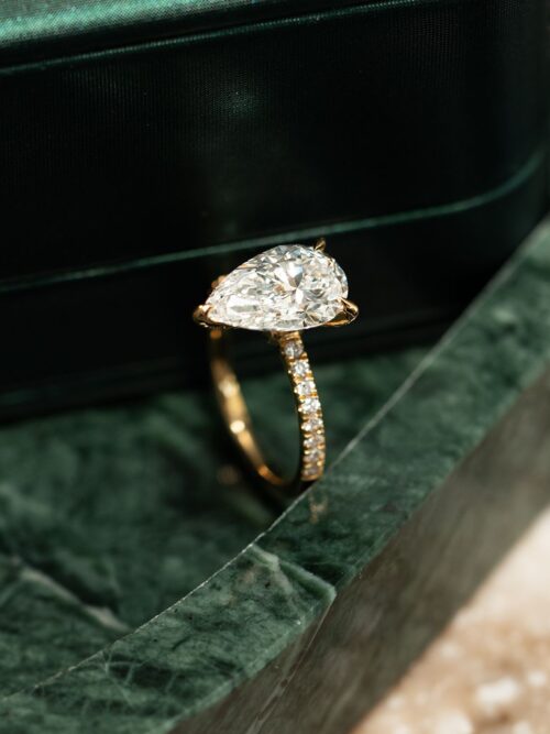Trotters 18ct Yellow Gold 3ct Pear Cut Lab Grown Diamond Ring With Diamond Set Shoulders And Diamond Set Claws