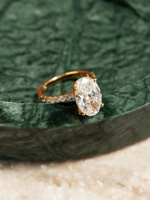 Trotters 18ct Yellow Gold 4ct Lab Grown Oval Diamond Ring With Diamond Set Shoulders & Hidden Diamond Halo