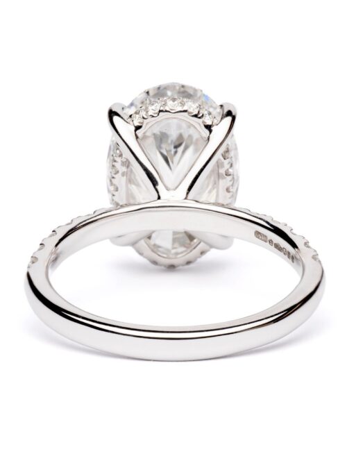 Trotters Platinum 5ct Oval Cut Lab Grown Diamond Ring With Diamond Set Shoulders And Hidden Diamond Halo