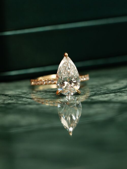 Trotters 18ct Yellow Gold 3ct Pear Cut Lab Grown Diamond Ring With Diamond Set Shoulders And Diamond Set Claws