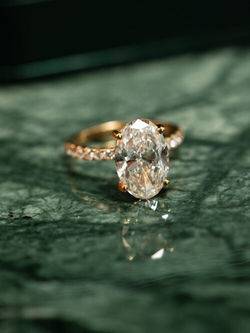 Trotters 18ct Yellow Gold 4ct Lab Grown Oval Diamond Ring With Diamond Set Shoulders & Hidden Diamond Halo