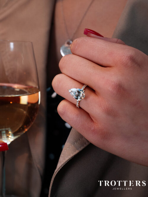 Trotters 18ct Yellow Gold 3ct Pear Cut Lab Grown Diamond Ring With Diamond Set Shoulders And Diamond Set Claws
