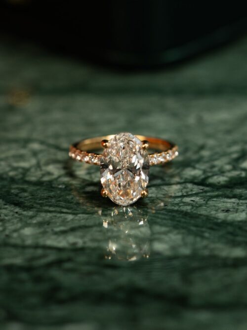 Trotters 18ct Yellow Gold 4ct Lab Grown Oval Diamond Ring With Diamond Set Shoulders & Hidden Diamond Halo