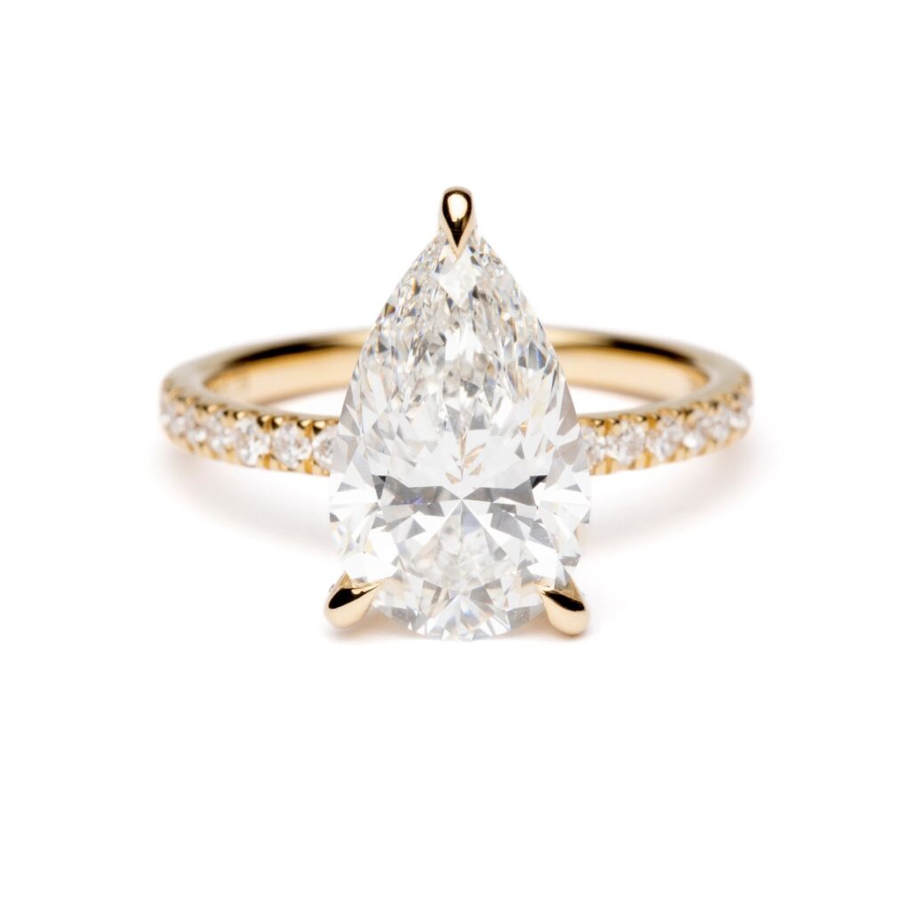 Trotters 18ct Yellow Gold 3ct Pear Cut Lab Grown Diamond Ring With Diamond Set Shoulders And Diamond Set Claws