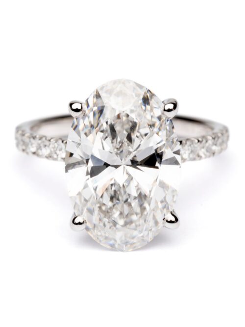 Trotters Platinum 5ct Oval Cut Lab Grown Diamond Ring With Diamond Set Shoulders And Hidden Diamond Halo